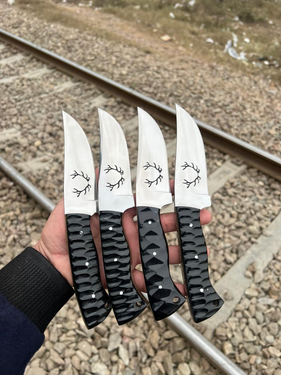 WhatsApp Image 2026-06-12 at 8.30.38 PM (1) Set of 4 Handmade Mirror Polish Hunting Knives – Antler Etched Blade & Black Textured Handle - Image 1